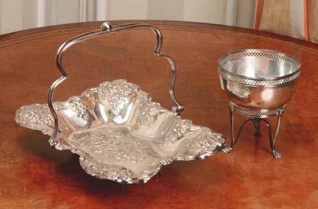 Appraisal: A SILVER PLATED CAKE BASKET with shaped sides pressed flower