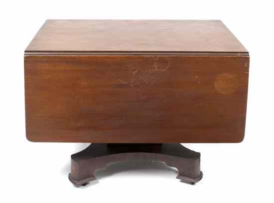 Appraisal: An American Empire Drop-Leaf Table having a rectangular top with