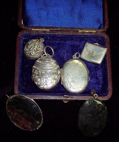 Appraisal: An oval silver pendant with engraved decoration and sundry pendants