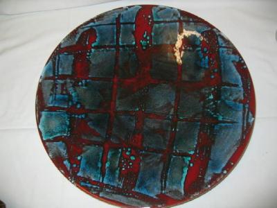 Appraisal: A POOLE DELPHIS POTTERY CHARGER painted in a blue square