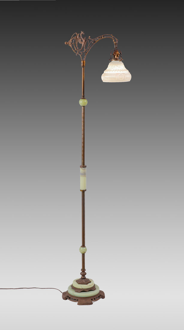 Appraisal: CAST IRON AND ONYX GRIFFIN FLOOR LAMP Patinated cast iron