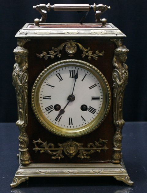 Appraisal: A French second empire style carriage clock in ringwood and