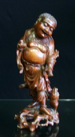 Appraisal: A Chinese carved wooden figure damaged