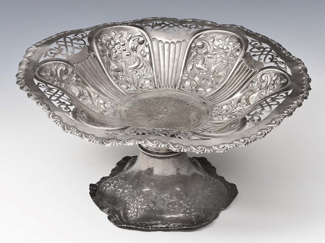 Appraisal: AN EDWARDIAN SILVER TAZZA with six panels decorated with scrolls