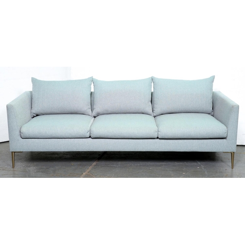 Appraisal: A three seat contemporary sofa upholstered in pale blue fabric