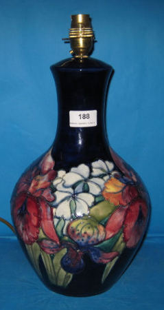 Appraisal: Moorcroft Lampbase decorated in the Frilled Orchid design height cm