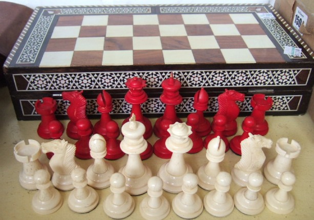 Appraisal: A stained bone chess set late th century the king