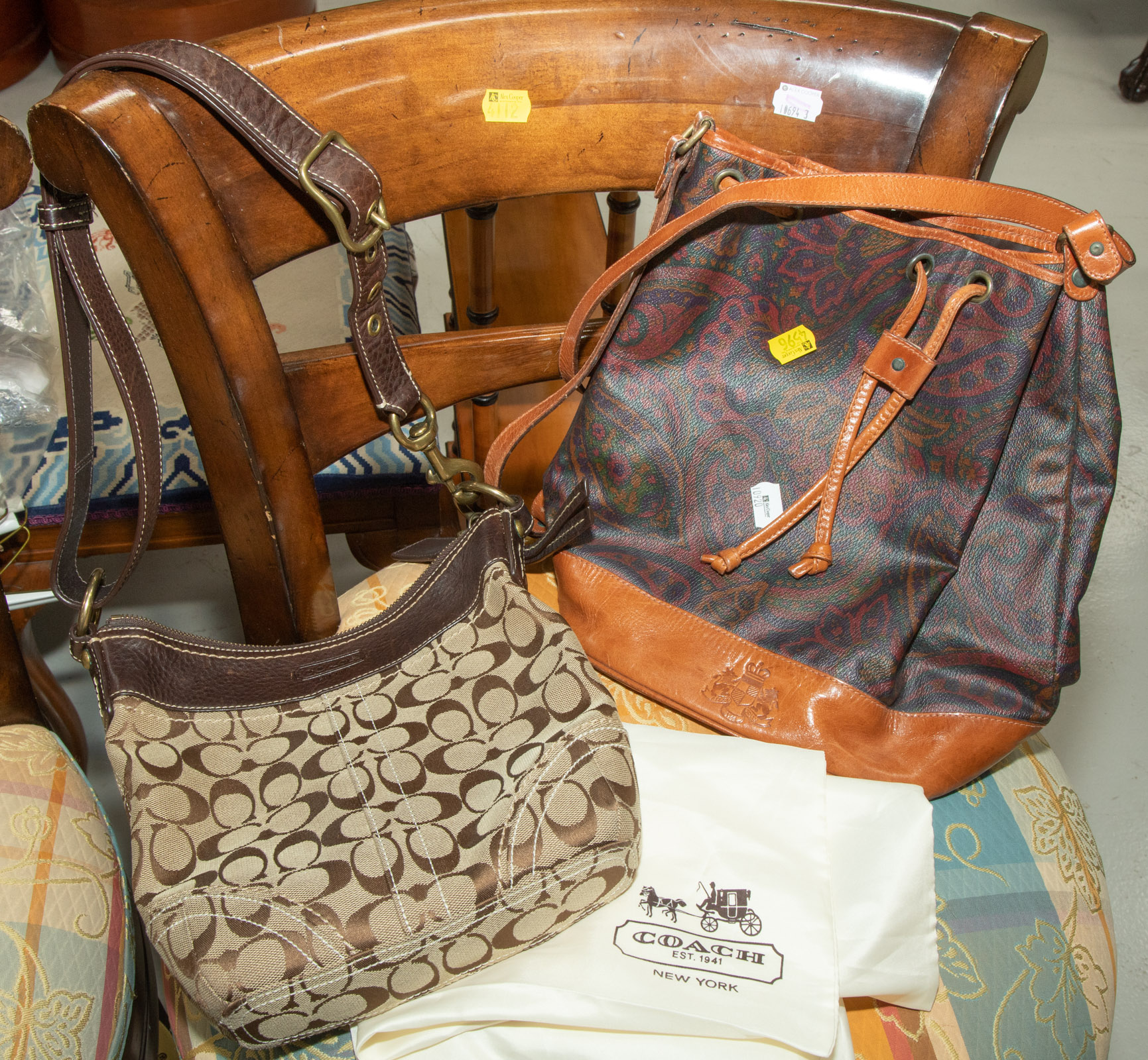 Appraisal: TWO HANDBAGS ALLEN LOLLY COACH Includes an Allen Lolly made