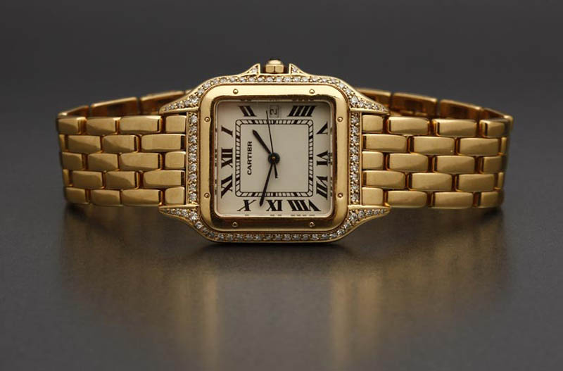 Appraisal: A Cartier large gold and diamond tank watch A Cartier