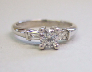 Appraisal: An ct white gold and diamond set three stone ring