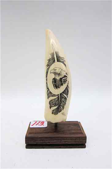 Appraisal: SCOTT PARKER SCRIMSHAWED IVORY WHALE'S TOOTH depicting a bald eagle