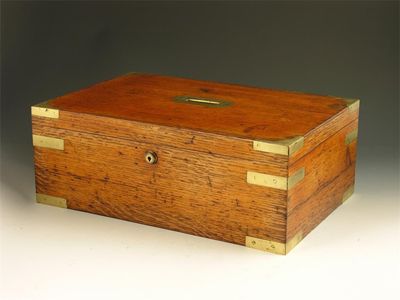 Appraisal: A Victorian oak and brass bound box with a sunken