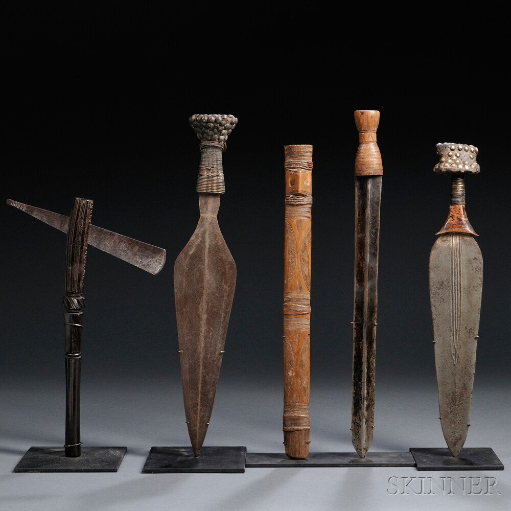 Appraisal: Four African Weapons includes two knives with copper-wrapped and brass-tacked