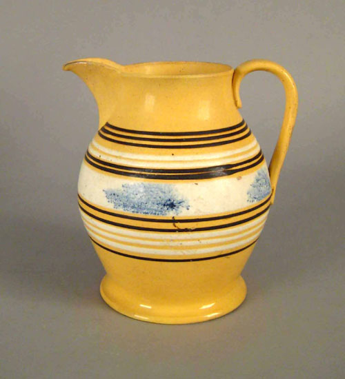 Appraisal: Large yelloware pitcher th c with seaweed decoration h