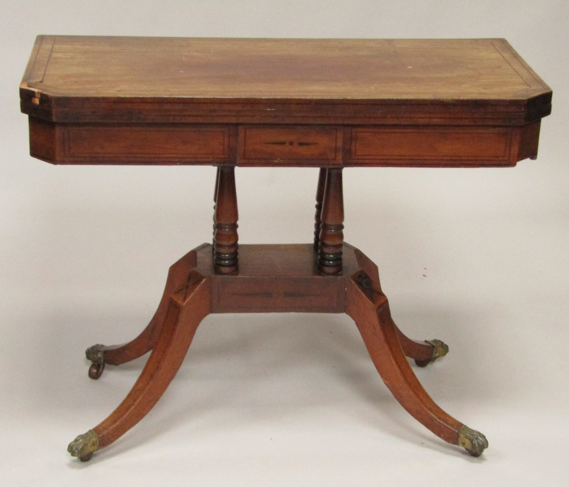 Appraisal: A Regency rosewood and ebony inlaid card table the fold