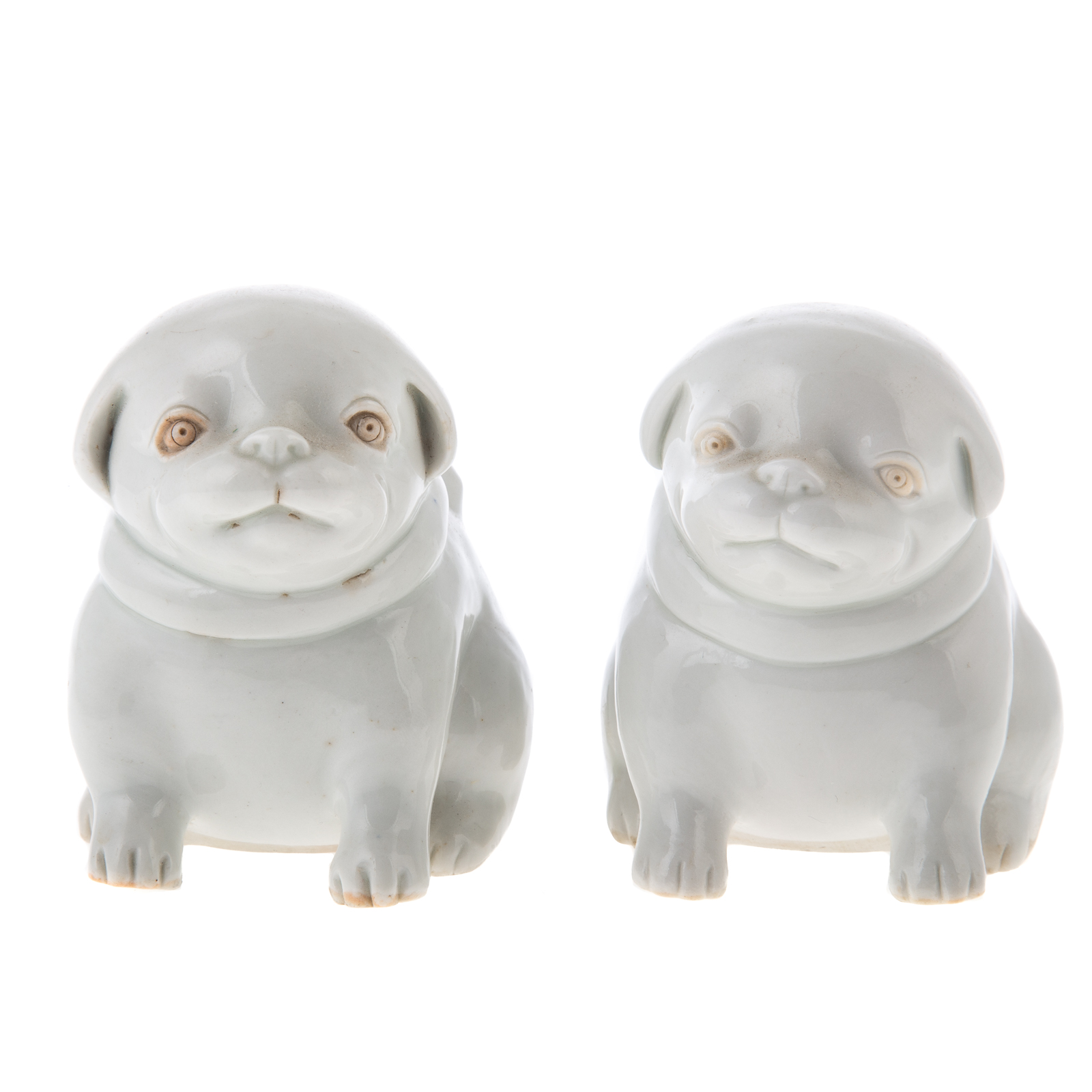 Appraisal: A PAIR OF JAPANESE BLANC DE CHINE PORCELAIN DOGS late