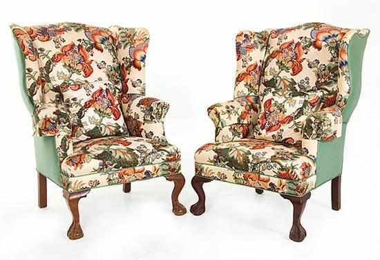 Appraisal: Near pair Chippendale style mahogany wingback chairs serpentine crestrail and