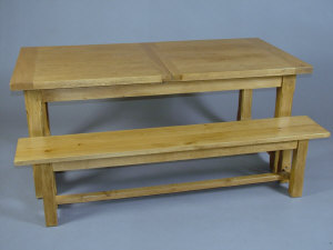 Appraisal: A blonde oak extendable dining table early th century the