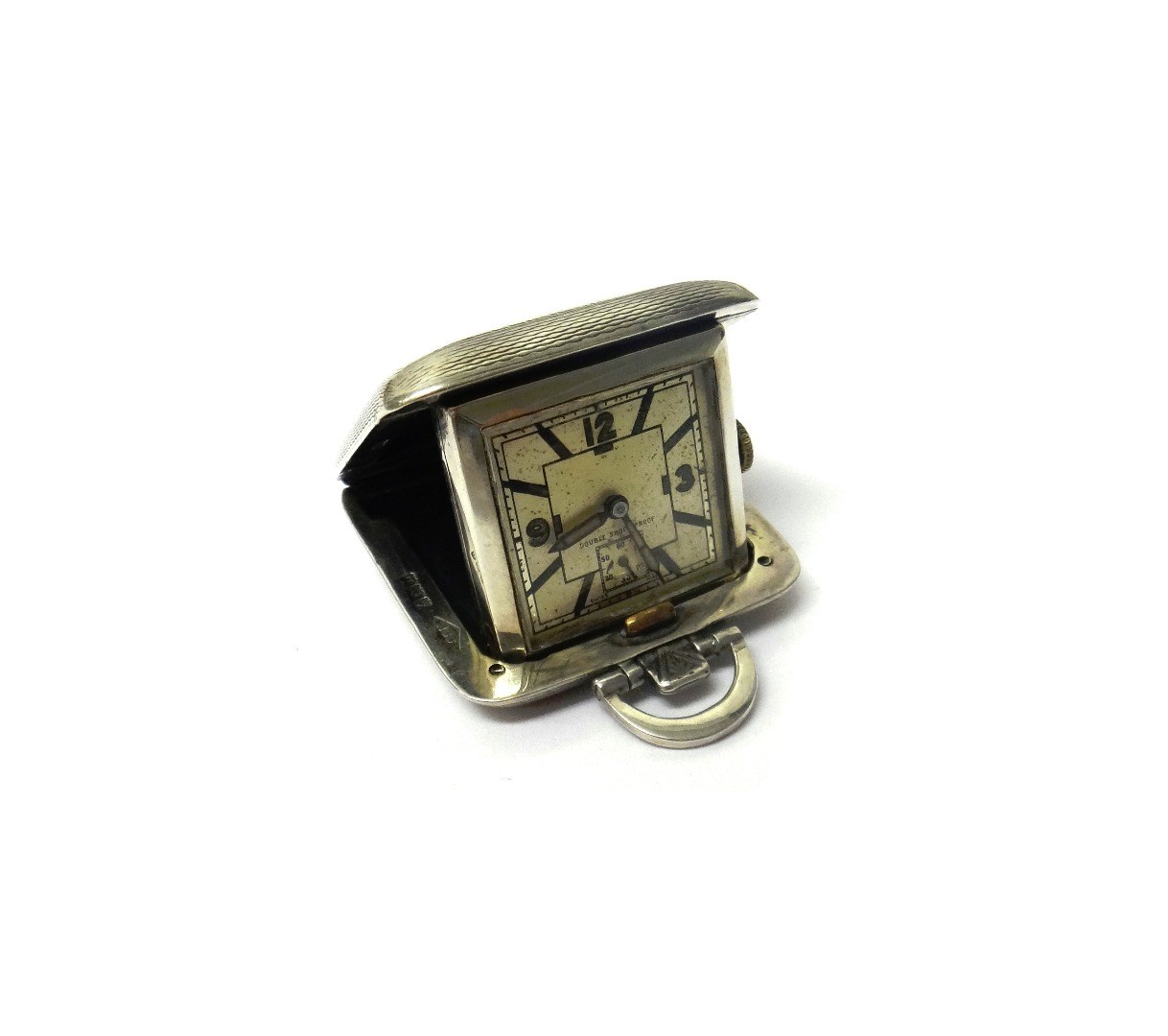 Appraisal: A lady's silver square cased folding travelling watch the silvered