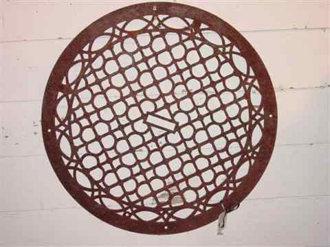 Appraisal: CAST IRON CIRCULAR FLOOD GRATE with pierced grid design -