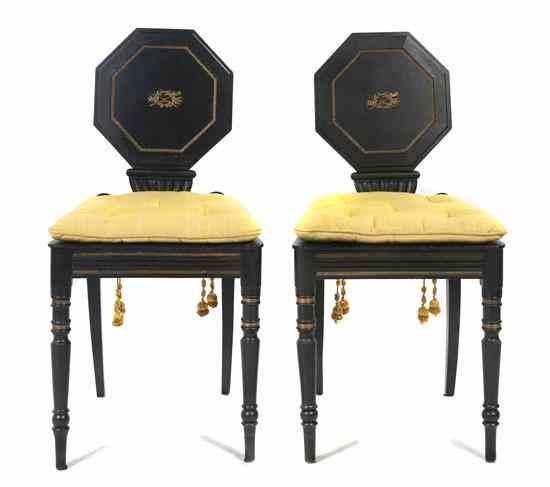 Appraisal: A Pair of English Ebonized and Parcel Gilt Hall Chairs