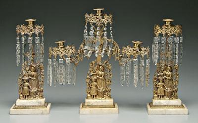 Appraisal: Three piece girandole set brass standards with woman and child