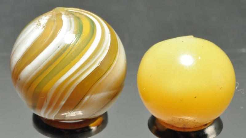 Appraisal: Lot of Opaque Marbles Description Smallest is a solid butterscotch