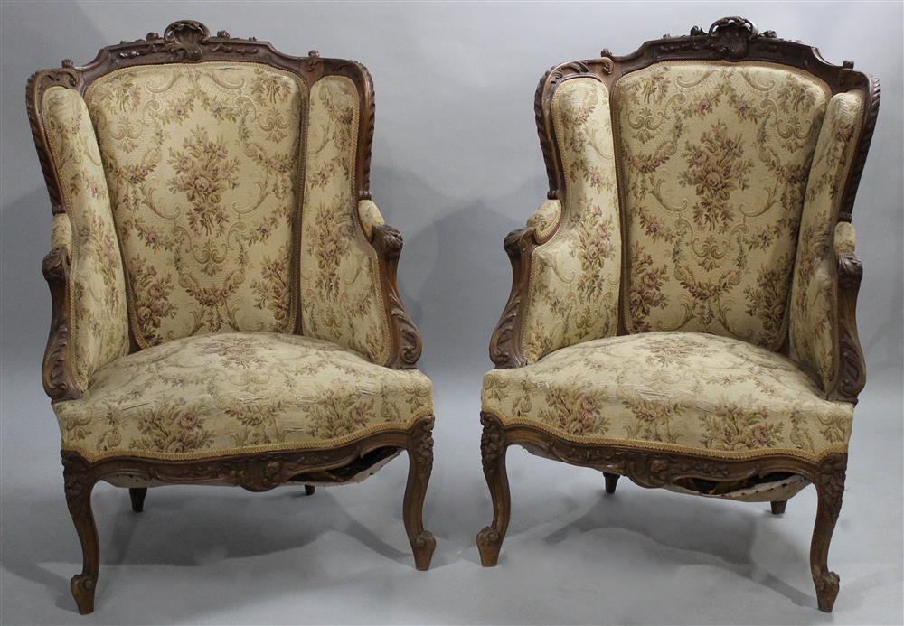 Appraisal: PAIR OF LOUIS XV STYLE WALNUT BERGERES BY L ANDRE