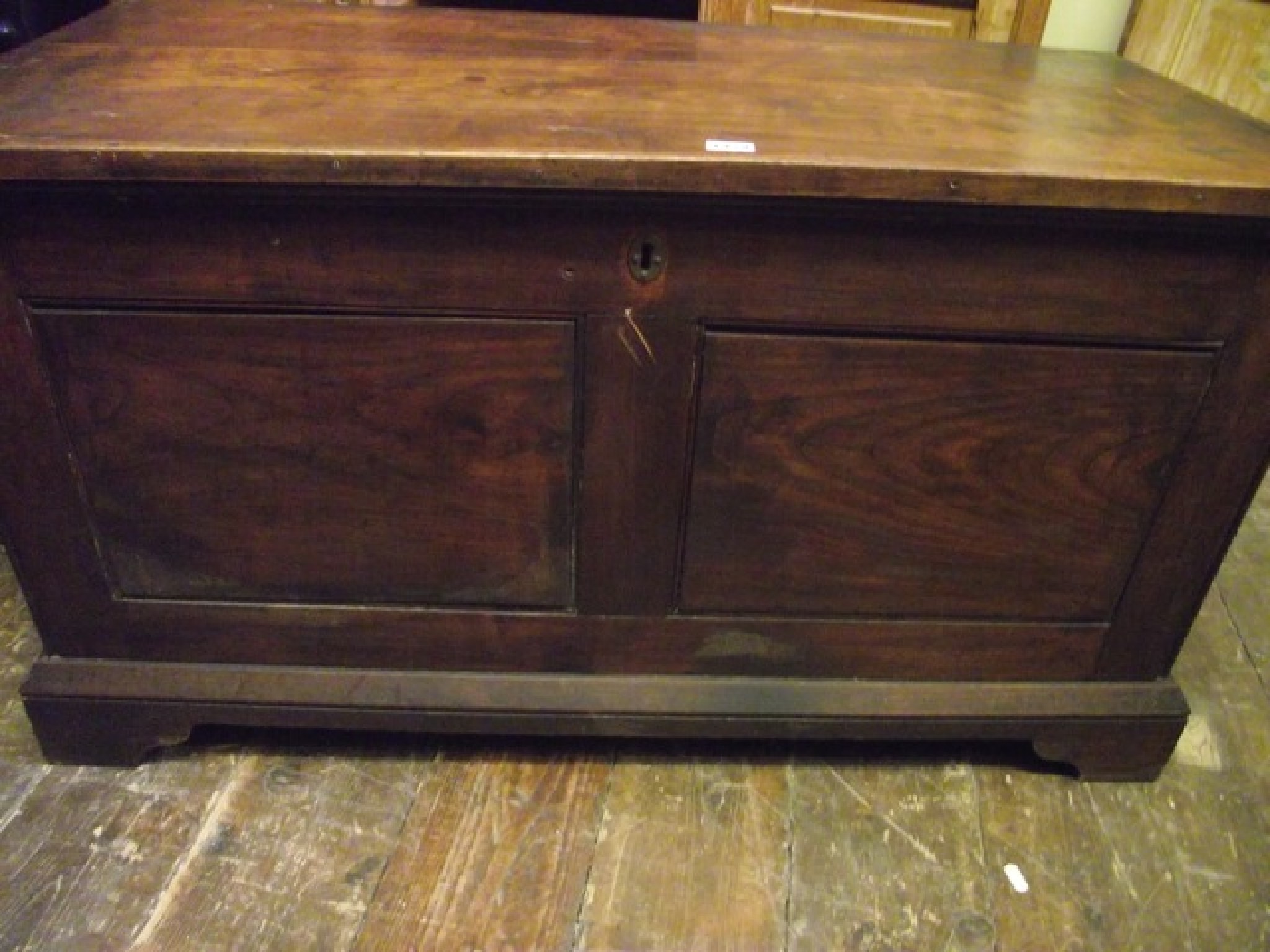 Appraisal: A th century fruitwood coffer of panelled form on bracket