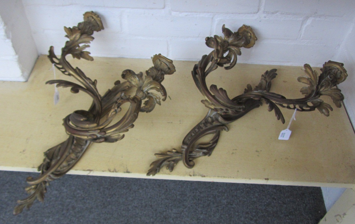 Appraisal: A pair of French gilt bronze wall appliques of rococo