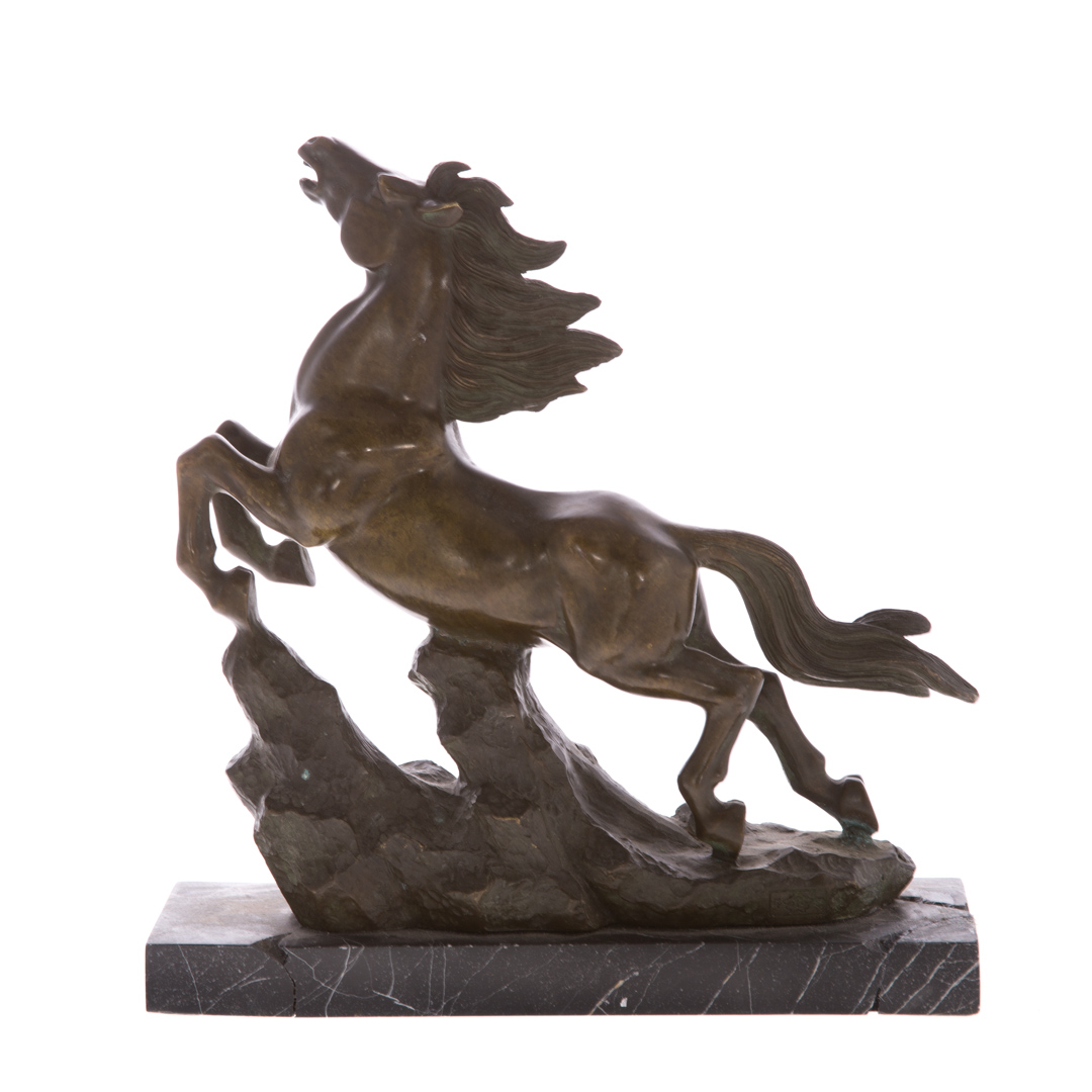 Appraisal: Bronze horse figure modeled as prancing horse on rocky ledge