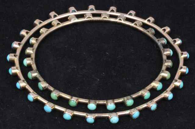 Appraisal: Two bangles set with turquoise beads the larger cm diameter