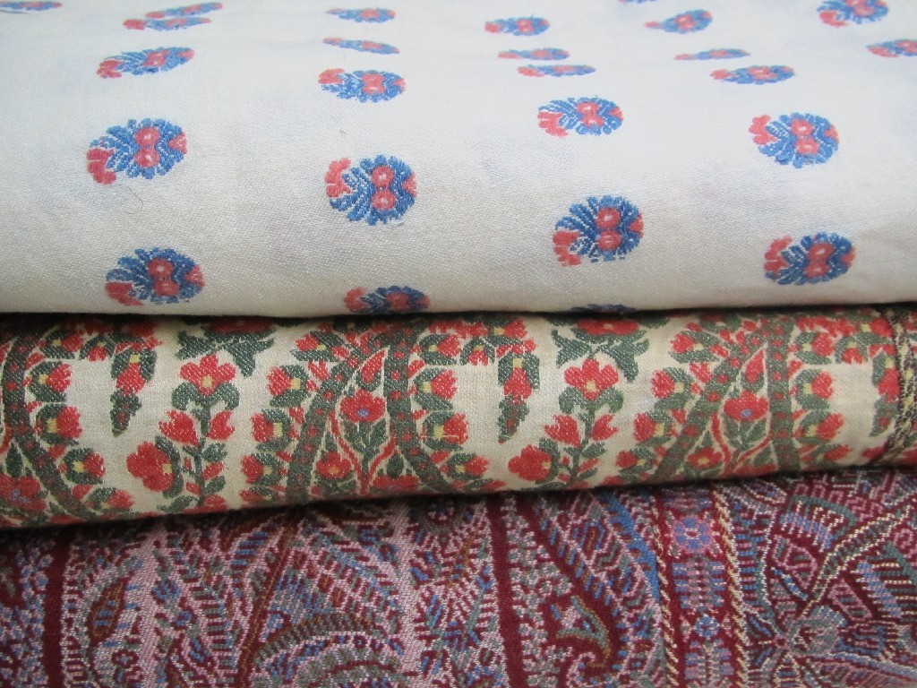 Appraisal: Three various Paisley Shawls two cream ground the other red