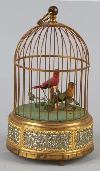 Appraisal: Wind-Up Birds In Wire Cage Two birds perched in a