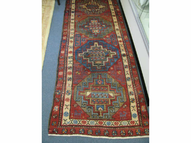 Appraisal: Heriz Persian Handmade Runner four geometric medallions on red field