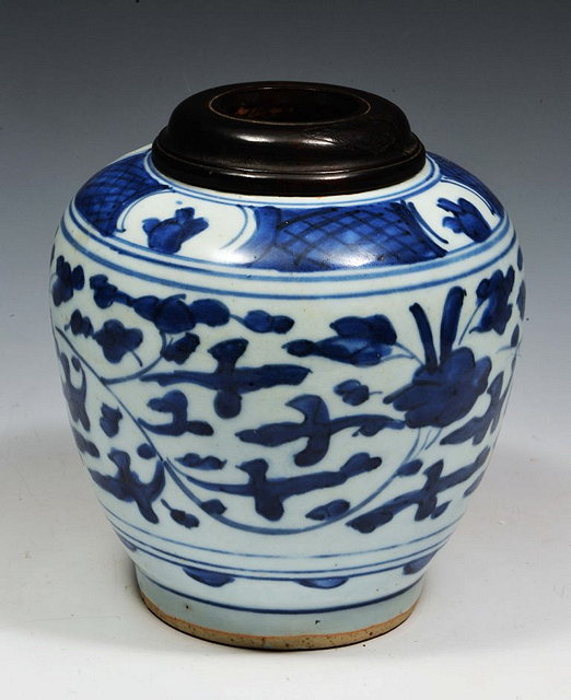 Appraisal: A CHINESE BLUE AND WOOD PORCELAIN TAPERING JAR with hardwood