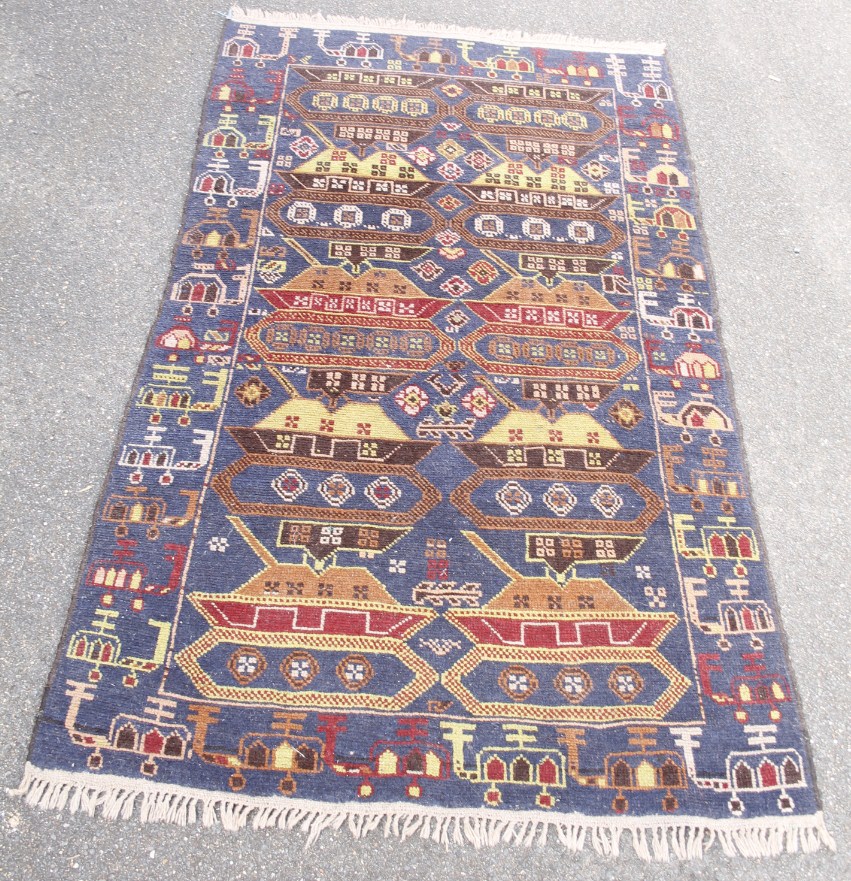 Appraisal: A Persian type rug with a geometric design on a