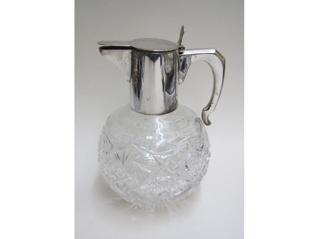 Appraisal: A Continental silver mounted and cut crystal claret jug with