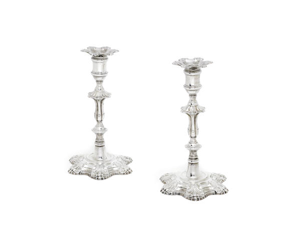 Appraisal: A pair of George III cast silver candlesticks by William