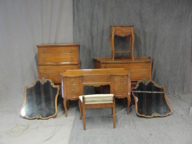 Appraisal: Satinwood Bedroom Set pieces A bed mirrors a bench an