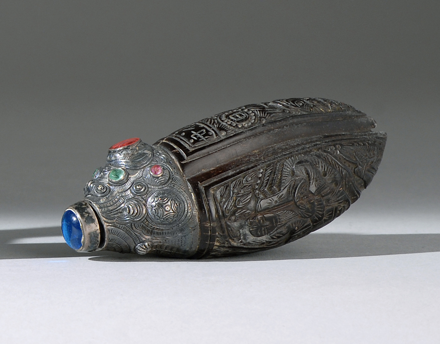 Appraisal: COCONUT SHELL SNUFF BOTTLE In trefoil form with figural and