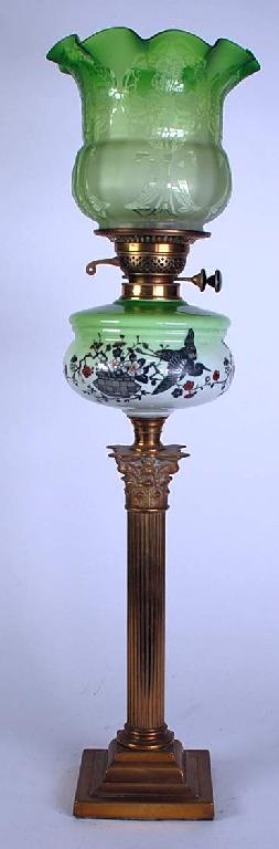 Appraisal: BRASS OIL TABLE LAMP AND SHADE the cylindrical Corinthian column