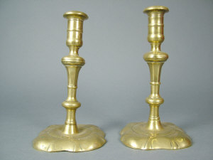 Appraisal: A pair of th century brass candlesticks of baluster form