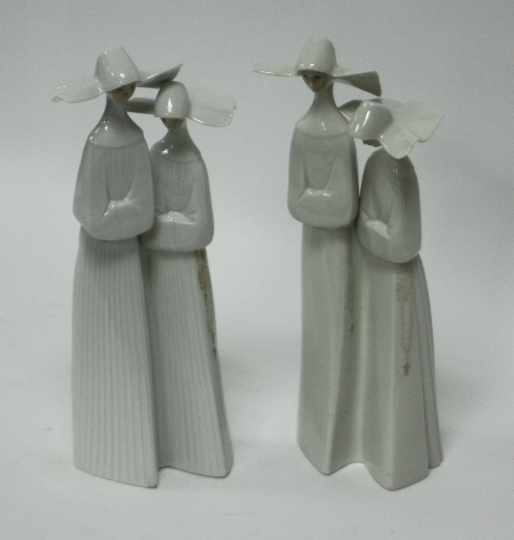 Appraisal: A Lladro figure of two nuns cm high and another