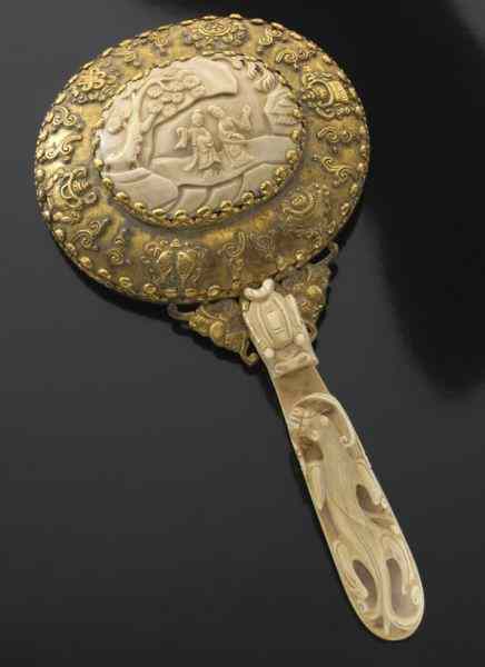 Appraisal: Chinese Qing carved ivory hand mirror International buyers should note