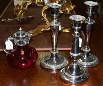 Appraisal: Three plated candlesticks and a ruby tinted glass claret jug