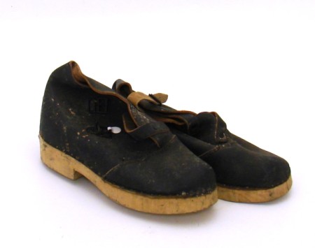 Appraisal: Lot consists of a pair of solid wood bottomed shoes