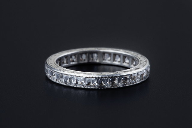 Appraisal: A full hoop eternity ring channel set throughout with calibr