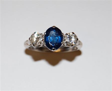 Appraisal: A three stone platinum set diamond and sapphire ring the