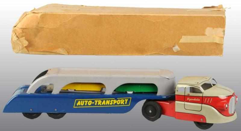 Appraisal: Pressed Steel Wyandotte Auto-Transport Truck Toy Description American Accessories consist